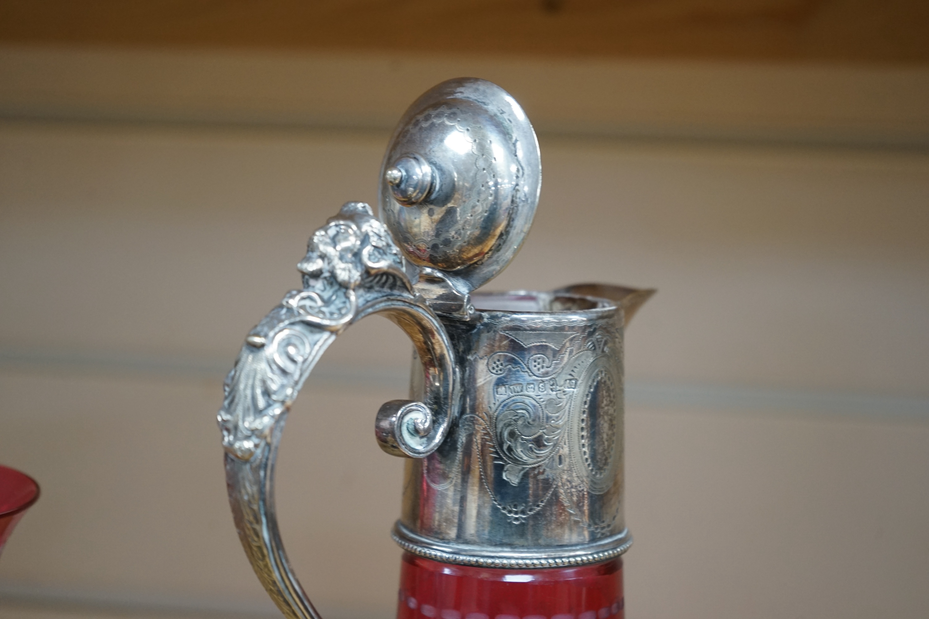 A Victorian electroplate mounted cranberry glass claret jug and a similar goblet by Elkington & Co. 26cm. Condition - good